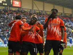 Pelly Ruddock-Mpanzu leads the celebrations after Elijah Adebayo`s goal