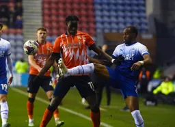 Ryan Nyambe raises his foot in front of Elijah Adebayo