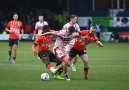 Pelly Ruddock-Mpanzu and Allan Campbell combine to halt this Grimsby attack
