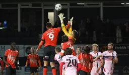 Carlton Morris puts Max Crocombe under pressure