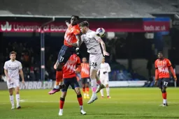 Elijah Adebayo wins this heading duel