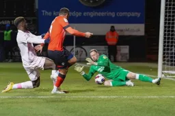 Ryan Allsop goes down to save from Carlton Morris