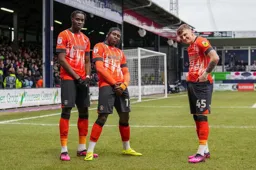 Pelly Ruddock-Mpanzu celebrates his goal with Elijah Adebayo and Alfie Doughty