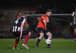 Luke Berry looks to control the ball