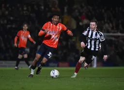 Gabriel Osho in a race for the ball against Harry Clifton