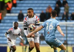 Carlton Morris looks to protect himself