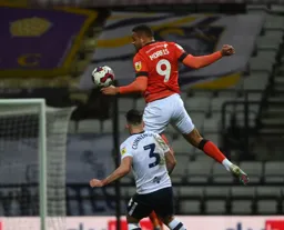 Looks like Carlton Morris is balancing the ball on his hand