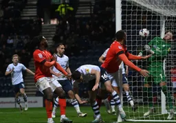 Carlton Morris squeezes the ball into the net from a tight angle