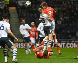 Luke Berry goes in search of a late winner with this header