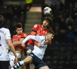 Tom Lockyer gets the better of Troy Parrott to win the header
