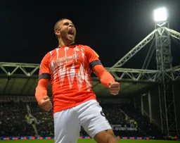 Carlton Morris roars with delight after scoring the Town`s only goal of the night