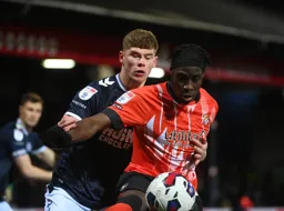 Elijah Adebayo is closely marked