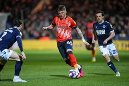 Alfie Doughty skips around a defender