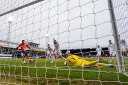 A worms eye view of Carlton Morris scoring the only goal of the game