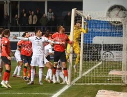 Carlton Morris watches the ball land on the roof of the net