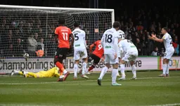 Carlton Morris wheels away after scoring the only goal of the game