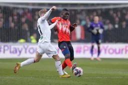Marvelous Nakamba competes for the ball with Oli Cooper