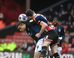 John Egan climbs all over Carlton Morris