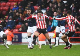 Sonny Bradley challenges from behind