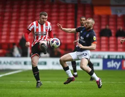 Allan Campbell goes in with a typical full blooded challenge