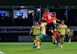 Carlton Morris hidden behind Luke Berry heads in the only goal of the game