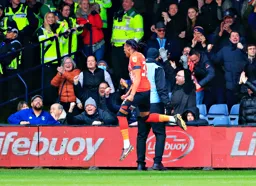 Gabriel Osho celebrates so too do the fans and the stewards