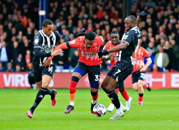 Gabriel Osho moves between Joao Pedro and Keinan Davis