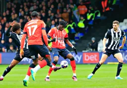 Elijah Adebayo and Hamza Choudhury compete for the ball