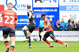 Elijah Adebayo lines up a shot at goal