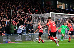Allan Campbell celebrates scoring the second. Daniel Bachmann looks less impressed.