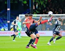 Cody Drameh lifts his foot to the ball