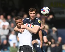 Jake Cooper wraps his arms around Carlton Morris