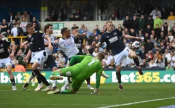 Carlton Morris`s goalbound effort is cleared by George Saville