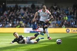 Alfie Doughty hurdles over Danny McNamara