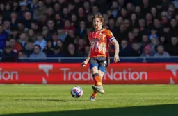 Tom Lockyer plays the ball forward