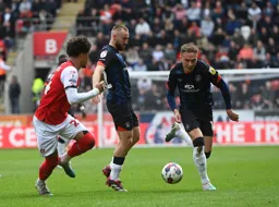 Allan Campbell stands aside as Cauley Woodrow moves through with the ball