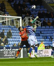 Joe Lumley punches the ball clear from Tom Lockyer