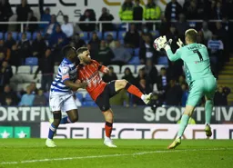 Jordan Clark raises his foot as Joe Lumley grabs the ball