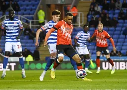 Carlton Morris shields the ball