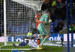 Carlton Morris wrestles for the ball with Joe Lumley after the scoring the Town`s goal