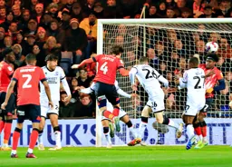 Tom Lockyer heads in the Town`s first goal