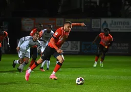 Carlton Morris steps forward to take the penalty which resulted in the Town`s second goal