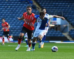 Harry Pickering holds off Carlton Morris
