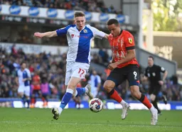 Carlton Morris competes for the ball