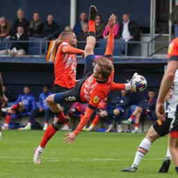 Henri Lansbury and Luke Berry get themselves in to a bit of a tangle