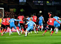 Jordan Clark heads the ball across the goal