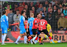 Tom Lockyer celebrates Gabriel Osho`s goal