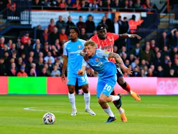 Elijah Adebayo trys to get past Jack Clarke