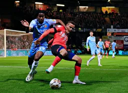 Carlton Morris under pressure from Pierre Ekwah