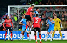 Carlton morris with a headed attempt on goal